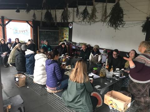 Summer Home Medicine workshop gathering of participants inside the outdoor classroom at Laudato Si Centre